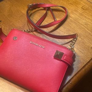 Red crossbody bag.